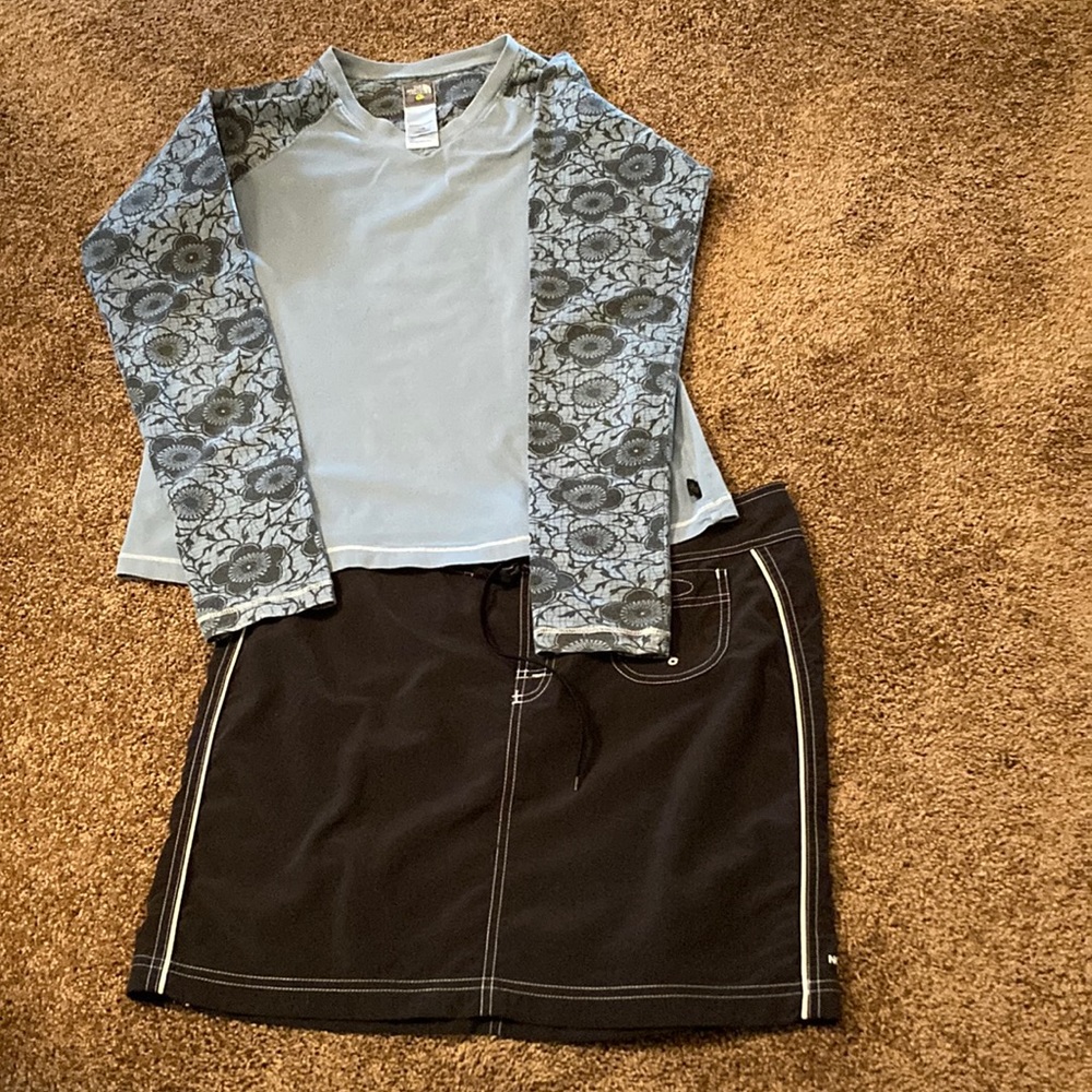 NORTH FACE 2 PIECE OUTFIT. NAVY AND MEDUIM BLUE. TOP IS A LARGE. SKIRT IS A 10